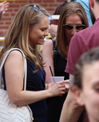 A Young Lady Enjoys Her Drink at the Varga Bar Block Party.